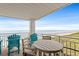 Relax on the condo balcony with ocean views, comfortable seating, and a calming atmosphere at 5800 N Ocean Blvd. # 405, North Myrtle Beach, SC 29582
