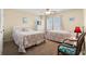 Relaxing bedroom with carpet, ceiling fan and two beds at 5800 N Ocean Blvd. # 405, North Myrtle Beach, SC 29582