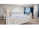 Serene bedroom featuring a beautiful white bed, blue accents, and ocean views, offering a tranquil retreat at 5800 N Ocean Blvd. # 405, North Myrtle Beach, SC 29582