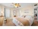 A quaint bedroom decorated with a beach theme, carpet and ceiling fan at 5800 N Ocean Blvd. # 405, North Myrtle Beach, SC 29582