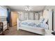 Spacious bedroom with light wood armoire and nautical decor, providing a relaxing and comfortable atmosphere at 5800 N Ocean Blvd. # 405, North Myrtle Beach, SC 29582