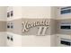 Condo sign Xanadu II in a tan two tone color and surrounded by several windows at 5800 N Ocean Blvd. # 405, North Myrtle Beach, SC 29582