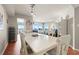 Bright dining area features a white table with ocean views, creating an inviting space for meals and gatherings at 5800 N Ocean Blvd. # 405, North Myrtle Beach, SC 29582