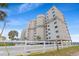 Exterior view of the multi-level condo building close to the sandy beach at 5800 N Ocean Blvd. # 405, North Myrtle Beach, SC 29582