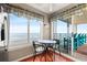 Eat-in kitchen nook, with stainless steel refrigerator, and views of the water from the sliding glass doors to balcony at 5800 N Ocean Blvd. # 405, North Myrtle Beach, SC 29582