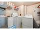Functional laundry room with washer, dryer, dehumidifier, and storage at 5800 N Ocean Blvd. # 405, North Myrtle Beach, SC 29582