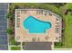 Overhead view of pristine community pool with lounge chairs and tables at 5840 Longwood Dr. # 303, Murrells Inlet, SC 29576
