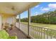 Balcony overlooking a golf course with chairs and table at 5840 Longwood Dr. # 303, Murrells Inlet, SC 29576