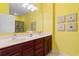 Bright bathroom features double vanity with wood cabinets, large mirror and nautical themed decorations at 5840 Longwood Dr. # 303, Murrells Inlet, SC 29576