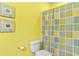 Bright bathroom with toilet and shower featuring a colorful patterned shower curtain and nautical decorations at 5840 Longwood Dr. # 303, Murrells Inlet, SC 29576