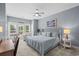 Cozy bedroom with large windows, comfortable furniture, carpeted floors, and natural light at 600 48Th Ave. S # 201, North Myrtle Beach, SC 29582