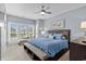 Comfortable bedroom with a large bed, chaise lounge, carpeted floors, and natural light at 600 48Th Ave. S # 201, North Myrtle Beach, SC 29582