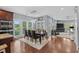 Modern dining area with hardwood flooring, large windows and an adjacent living area, perfect for entertaining at 600 48Th Ave. S # 201, North Myrtle Beach, SC 29582