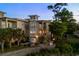 Stunning exterior view of the home featuring a pool, patio, and lush landscaping at 600 48Th Ave. S # 201, North Myrtle Beach, SC 29582