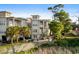 Coastal home with outdoor patio space, including a refreshing private pool, lush landscaping, and coastal charm at 600 48Th Ave. S # 201, North Myrtle Beach, SC 29582