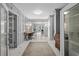 Inviting hallway with a marble floor and decorative desk leading to an outdoor pool area at 600 48Th Ave. S # 201, North Myrtle Beach, SC 29582