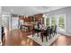 A modern kitchen with wood cabinets, granite countertops, stainless steel appliances, island and a dining area with seating at 600 48Th Ave. S # 201, North Myrtle Beach, SC 29582