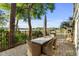 Outdoor patio with dining area, grill, and water view; perfect for entertaining at 600 48Th Ave. S # 201, North Myrtle Beach, SC 29582