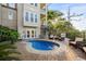 Charming backyard area with pool, lounge chairs and tropical foliage for outdoor relaxation and backyard entertaining at 600 48Th Ave. S # 201, North Myrtle Beach, SC 29582
