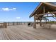 Expansive beach pavilion with covered seating overlooking the ocean; ideal for relaxation at 6001 South Kings Hwy., Myrtle Beach, SC 29575