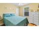 Comfortable bedroom with a ceiling fan and a window at 6001 South Kings Hwy., Myrtle Beach, SC 29575