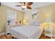 Cozy bedroom featuring a decorative mirror and a window with natural light at 6001 South Kings Hwy., Myrtle Beach, SC 29575