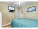 Bedroom featuring a TV mounted to the wall and a comfy bed at 6001 South Kings Hwy., Myrtle Beach, SC 29575