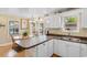 Open kitchen with a breakfast bar that overlooks the dining area, creating an inclusive cooking and dining experience at 6001 South Kings Hwy., Myrtle Beach, SC 29575