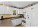 Well-appointed kitchen with white cabinets, modern appliances, and ample counter space for easy meal preparation at 6001 South Kings Hwy., Myrtle Beach, SC 29575