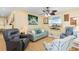 Comfortable living room with neutral colors, complemented by a ceiling fan and coastal-themed decorations for a relaxing atmosphere at 6001 South Kings Hwy., Myrtle Beach, SC 29575