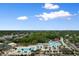 Aerial view of a waterpark with pools and slides, set amongst lush greenery and neighborhood at 6001 South Kings Hwy., Myrtle Beach, SC 29575
