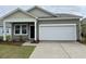 Charming single-story home with a two-car garage and well-manicured lawn at 610 Muster Field Ct., Conway, SC 29526