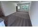 Bright living room with neutral carpet, fresh paint, and lots of natural light from the windows at 630 Muster Field Ct., Conway, SC 29526