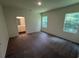 Comfortable main bedroom with plush carpet, an ensuite bathroom, and bright windows at 630 Muster Field Ct., Conway, SC 29526
