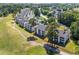 An aerial view of the condo complex with a golf course, and parking areas at 650 River Oaks Dr. # 46I, Myrtle Beach, SC 29579