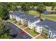 Aerial view of condo complex near a golf course, parking, and manicured landscaping at 650 River Oaks Dr. # 46I, Myrtle Beach, SC 29579