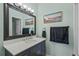 Well-lit bathroom with framed mirror, vanity, and modern fixtures at 650 River Oaks Dr. # 46I, Myrtle Beach, SC 29579