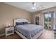 Bright bedroom featuring a king bed, a walk-in closet, and access to a private outdoor patio at 650 River Oaks Dr. # 46I, Myrtle Beach, SC 29579