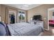 Bedroom with closet, dresser, television and sliding glass door to outdoor patio area at 650 River Oaks Dr. # 46I, Myrtle Beach, SC 29579