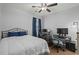Cozy bedroom with comfortable bed, desks, and computer setup at 650 River Oaks Dr. # 46I, Myrtle Beach, SC 29579
