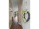 Entrance with a hallway and wood floors leading to the kitchen at 650 River Oaks Dr. # 46I, Myrtle Beach, SC 29579