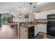 Modern kitchen with granite countertops and views of the living room at 650 River Oaks Dr. # 46I, Myrtle Beach, SC 29579