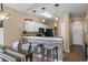 The kitchen features a bar countertop, white cabinets, and stainless steel appliances at 650 River Oaks Dr. # 46I, Myrtle Beach, SC 29579