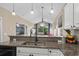 Modern kitchen with granite counters, stainless steel sink and appliances, with view to living space at 650 River Oaks Dr. # 46I, Myrtle Beach, SC 29579