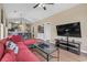 Comfortable living room featuring a large television and open layout into dining area at 650 River Oaks Dr. # 46I, Myrtle Beach, SC 29579