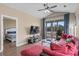 Inviting living room with a cozy red couch and scenic views from the screened in patio at 650 River Oaks Dr. # 46I, Myrtle Beach, SC 29579