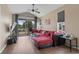 Bright living room with a red sofa, vaulted ceiling, and sliding door to the porch at 650 River Oaks Dr. # 46I, Myrtle Beach, SC 29579