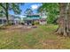 Backyard view of a two-story home with spacious yard at 715 9Th Ave. S, Surfside Beach, SC 29575