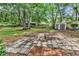 Spacious backyard featuring a fire pit and mature trees at 715 9Th Ave. S, Surfside Beach, SC 29575