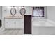Bathroom featuring dual sinks, soaking tub and updated finishes at 715 9Th Ave. S, Surfside Beach, SC 29575